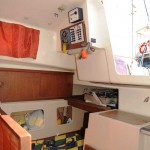 The galley unit slides back in to allow access to the quarterberth